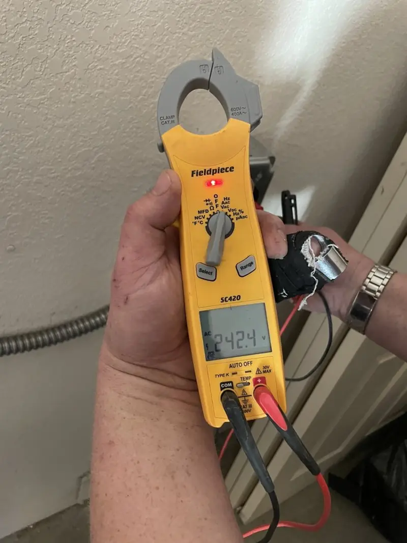 Voltage testing with clamp meter during Generator Installation in Boscobel